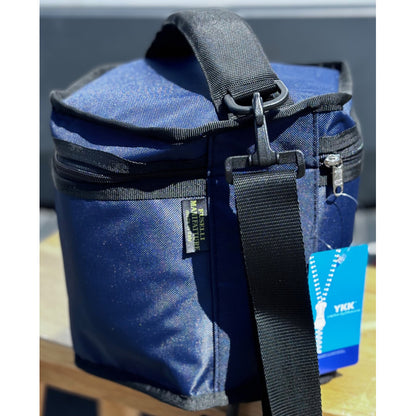 deluxe concertina bag in  blue show two carrying options handle and shoulder strap